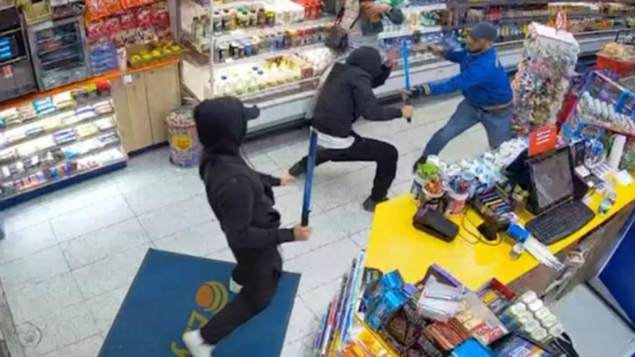 CCTV shows Melbourne convenience store worker Mohammed Panihani, 35, being attacked by two teens armed with swords. Picture: 7News