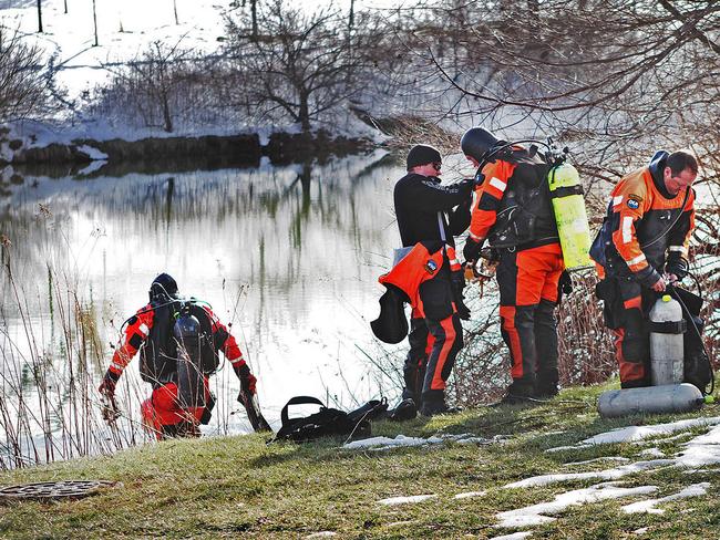 Police search a duck pond near where Nicole’s body was found.