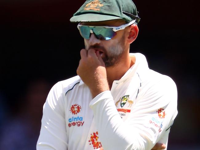 Australia's Nathan Lyon fields at the covers position during the day five of the fourth cricket Test match between Australia and India at The Gabba in Brisbane on January 19, 2021. (Photo by Patrick HAMILTON / AFP) / --IMAGE RESTRICTED TO EDITORIAL USE - STRICTLY NO COMMERCIAL USE--