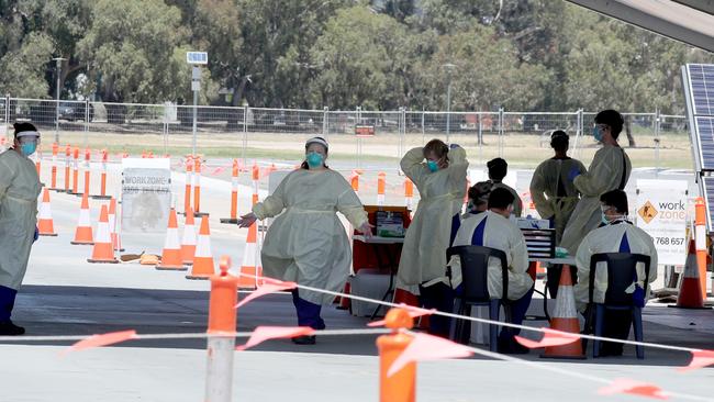 Health workers at the Victoria Park Pakapakanthi COVID-19 drive-through testing site. Picture: NCA NewsWire / Kelly Barnes