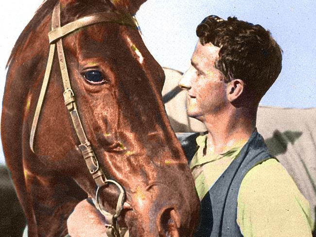 Colourised picture of Strapper Tommy Woodcock with Phar Lap