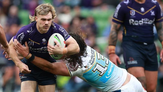 Ryan Papenhuyzen is tackled against the Titans. Photo: NRL PHOTOS