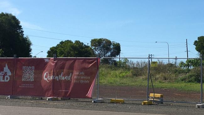 The Queensland Government banner adorned the fencing during the state election campaign but the only sign of work at the fire station site was a fresh mow.