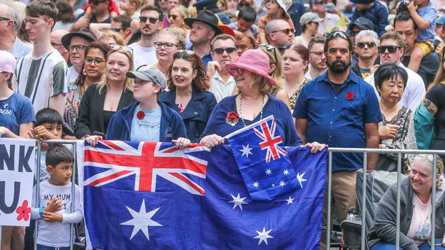 Jacob Dwyer-Hobbler and Jenny Dheurie among Thousands lining Adelaide St in Brisbane for the 2023 ANZAC Day March. Picture: NCA NewsWire / Glenn Campbell