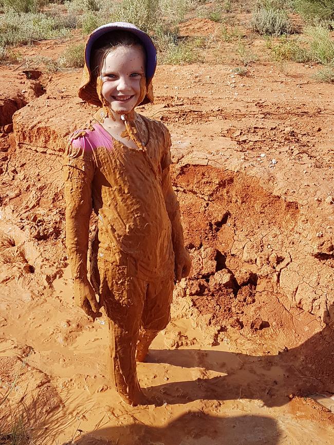 Skyelah Petty stays cool in the mud in Roxby Downs.