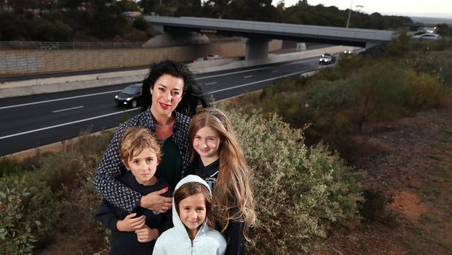 Michelle Ward, with her children Cormac, Harper, and Charlee near the Southern Expressway. Picture: Dylan Coker