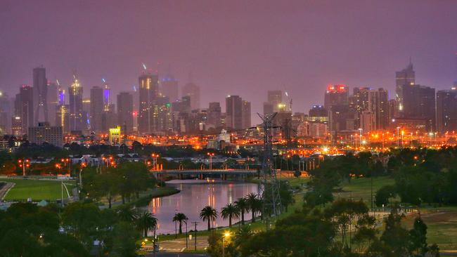 Melbourne skyline in fog at dawn from Quarry Park. Picture: Hamish Blair