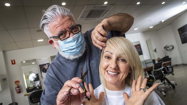 Tom Donato cuts Ann's hair at Xianghair in Essendon. Picture: Jake Nowakowski