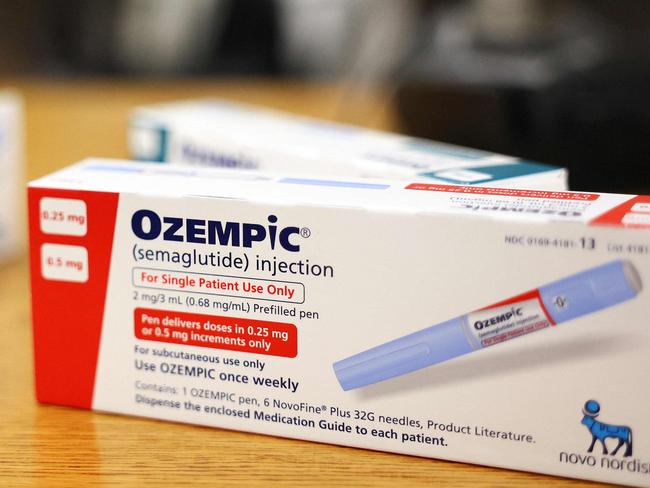 (FILES) This photo illustration shows boxes of the diabetes drug Ozempic resting on a pharmacy counter in Los Angeles, California, on April 17, 2023. Over 40 percent of Americans suffer from obesity, reflecting a major health crisis and the massive market for new Ozempic-type drugs. With their "groundbreaking" effectiveness, the drugs will be "the first line therapy for people who are obese," research physician Samuel Klein of Washington University in St. Louis told AFP. (Photo by MARIO TAMA / GETTY IMAGES NORTH AMERICA / AFP)