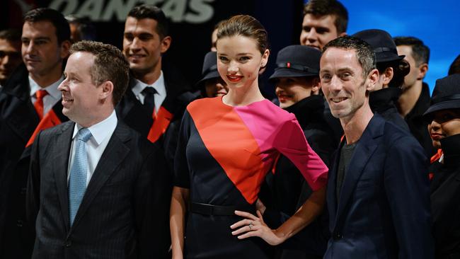 Smile high ... Qantas ambassador Miranda Kerr, pictured with Qantas CEO Alan Joyce (front left) and fashion designer Martin Grant (front right), could appear on the new Nine documentary series. Picture: AFP