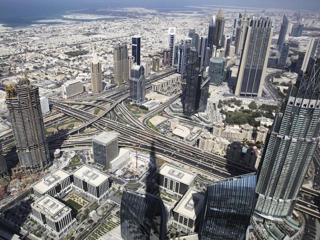 A general view of Dubai is shown from the Burj Khalifa tower, the world's tallest building, in Dubai, United Arab Emirates, Tuesday, Nov. 8, 2016. The futuristic city-state of Dubai announced a deal on Tuesday with Los Angeles-based Hyperloop One to study the potential for building a line linking it to the Emirati capital of Abu Dhabi. (AP Photo/Jon Gambrell)