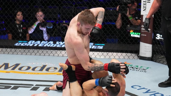 LAS VEGAS, NEVADA - AUGUST 08: (L-R) Tom Nolan of Australia elbows Bogdan Grad of Romania in a lightweight fight during Dana White's Contender Series season seven, week one at UFC APEX on August 08, 2023 in Las Vegas, Nevada. (Photo by Al Powers/Zuffa LLC)