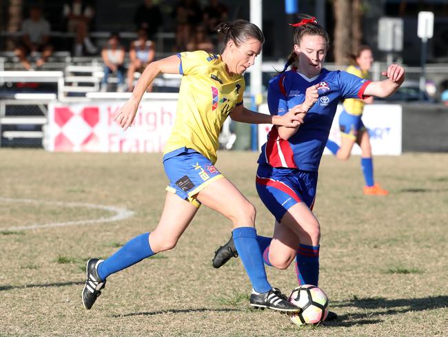 Broadbeach’s Megan Kehoe battles for possession with Robina’s Sophia Muller. Picture: Richard Gosling