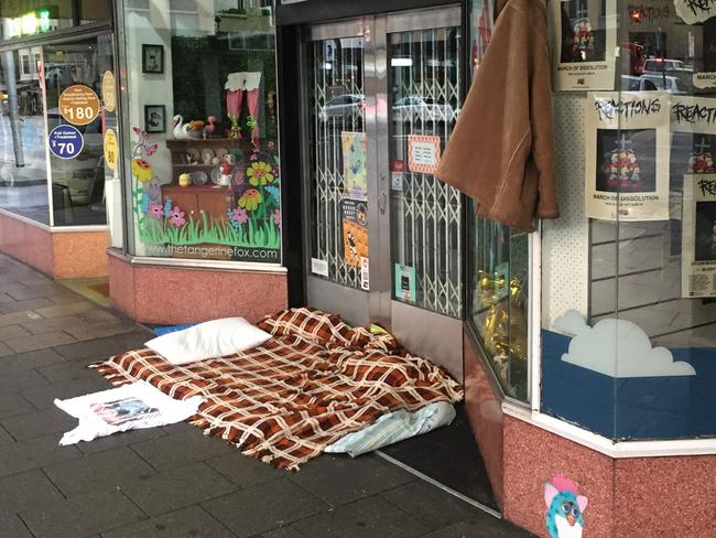 Rough sleeper outside Tangerine Fox on Pulteney St, Adelaide