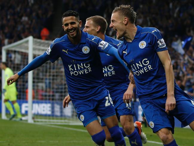 Leicester City's English striker Jamie Vardy (R) celebrates with Leicester City's Algerian midfielder Riyad Mahrez (L) after scoring during the English Premier League football match between Leicester City and Everton at King Power Stadium in Leicester, central England on May 7, 2016. / AFP PHOTO / ADRIAN DENNIS / RESTRICTED TO EDITORIAL USE. No use with unauthorized audio, video, data, fixture lists, club/league logos or 'live' services. Online in-match use limited to 75 images, no video emulation. No use in betting, games or single club/league/player publications. /