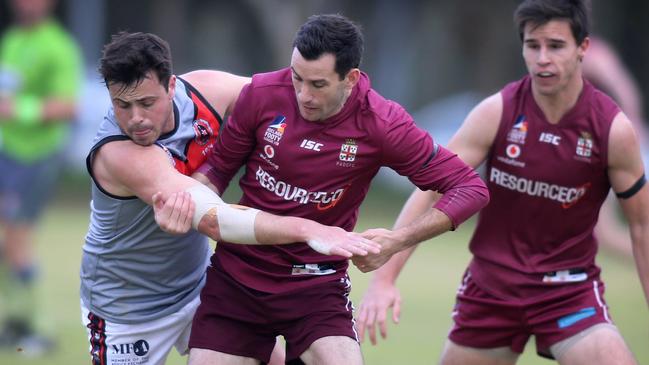 Prince Alfred OC’s Tom Bartlett wrestles with ROC’s Charles Jordan. Bartlett has been a prolific goal kicker this season. Picture: Dean Martin