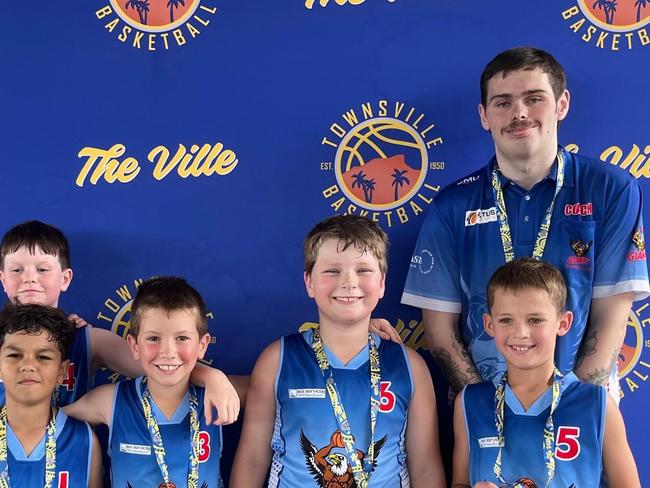 Lachlan Anderson, with the basketball team he coaches