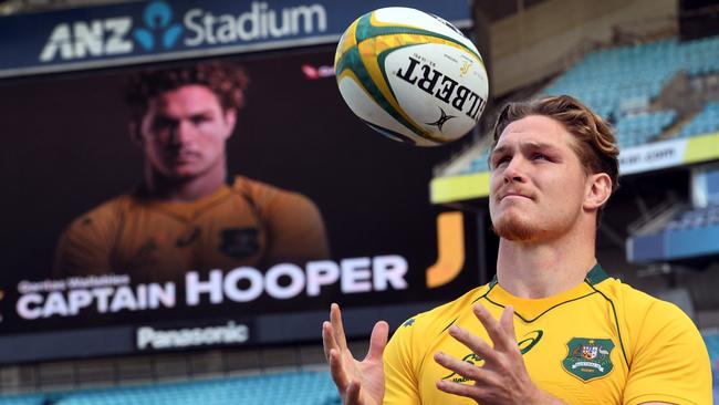 Australia captain Michael Hooper posing for the cameras at a press conference.