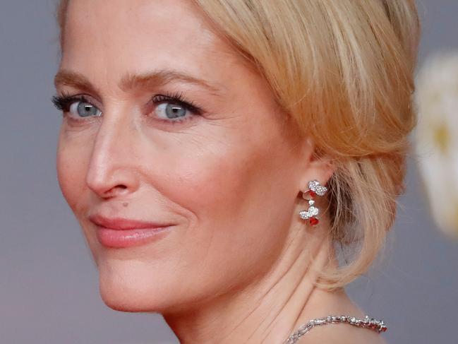 US actress Gillian Anderson poses on the red carpet upon arrival at the BAFTA British Academy Film Awards at the Royal Albert Hall in London on February 2, 2020. (Photo by Tolga AKMEN / AFP)