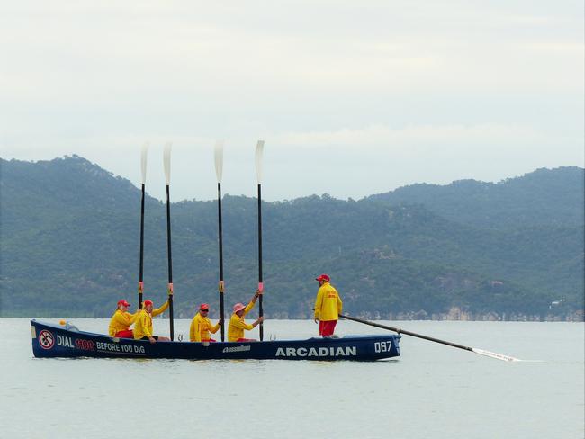 Members of the Arcadian SLSC observe a moment of silence for Surf Life Saving memorial Day. Picture: Blair Jackson.