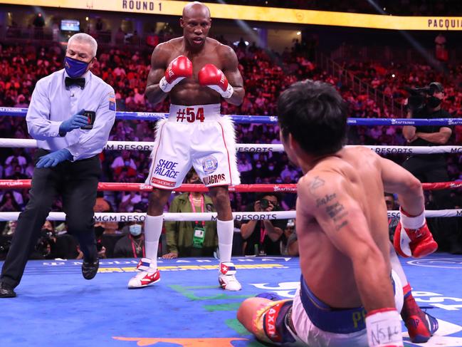 Pacquiao (R) slips in the first round of the WBA welterweight title fight against Ugas, which the Filipino champion lost. Picture: Steve Marcus/Getty Images/AFP