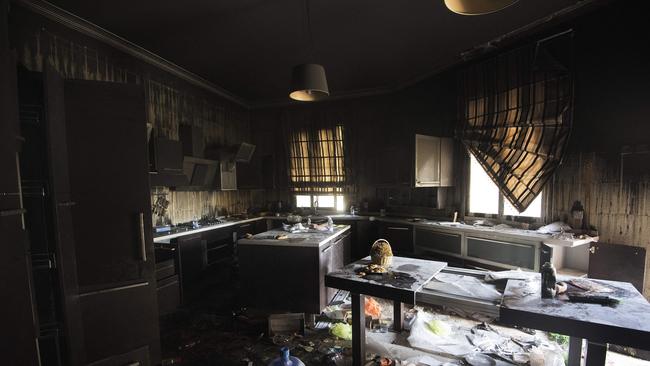 File image of a burnt-out property. (Photo by GIANLUIGI GUERCIA / AFP)