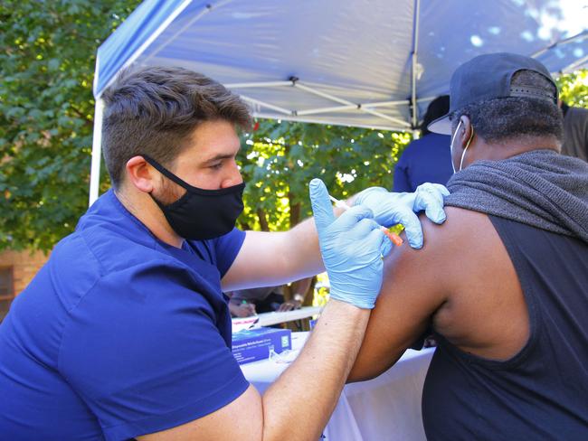 A health worker administers a Pfizer-BioNTech vaccine at a #VAXTOSCHOOL pop-up site in New York. Picture: Getty Images/AFP