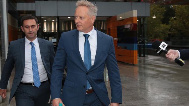 Sam Henderson, right, leaves the royal commission earlier this week