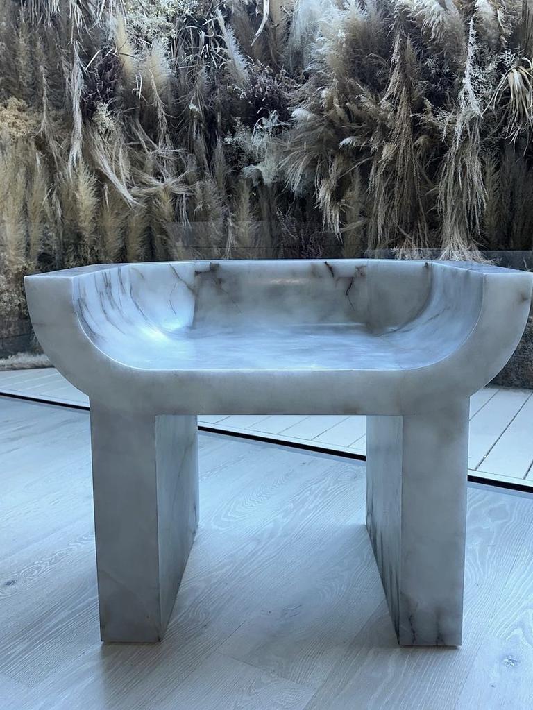 A marble seat in the minimalist bathroom.