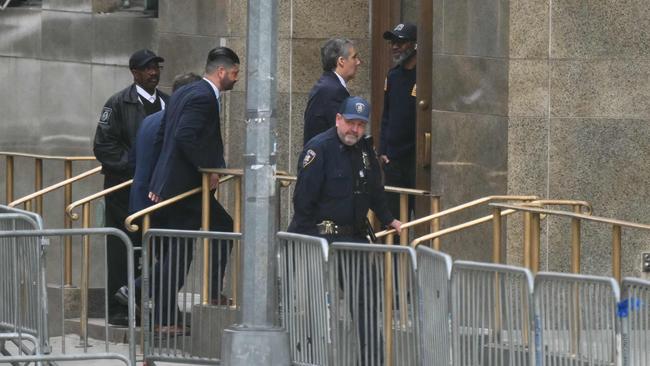 Former Trump lawyer Michael Cohen, centre, arrives at Manhattan Criminal Court for the trial of former US resident Donald Trump for allegedly covering up hush money payments linked to extramarital affairs. Picture: Angela Weiss/AFP