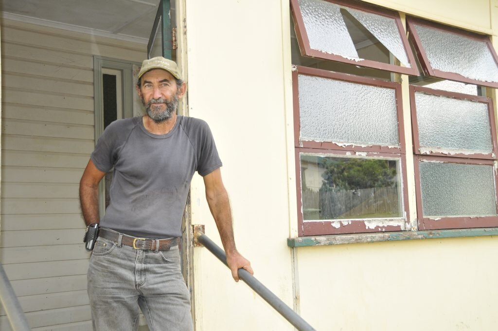 Joe Courte stands outside his rental property. Picture: Gen Kennedy