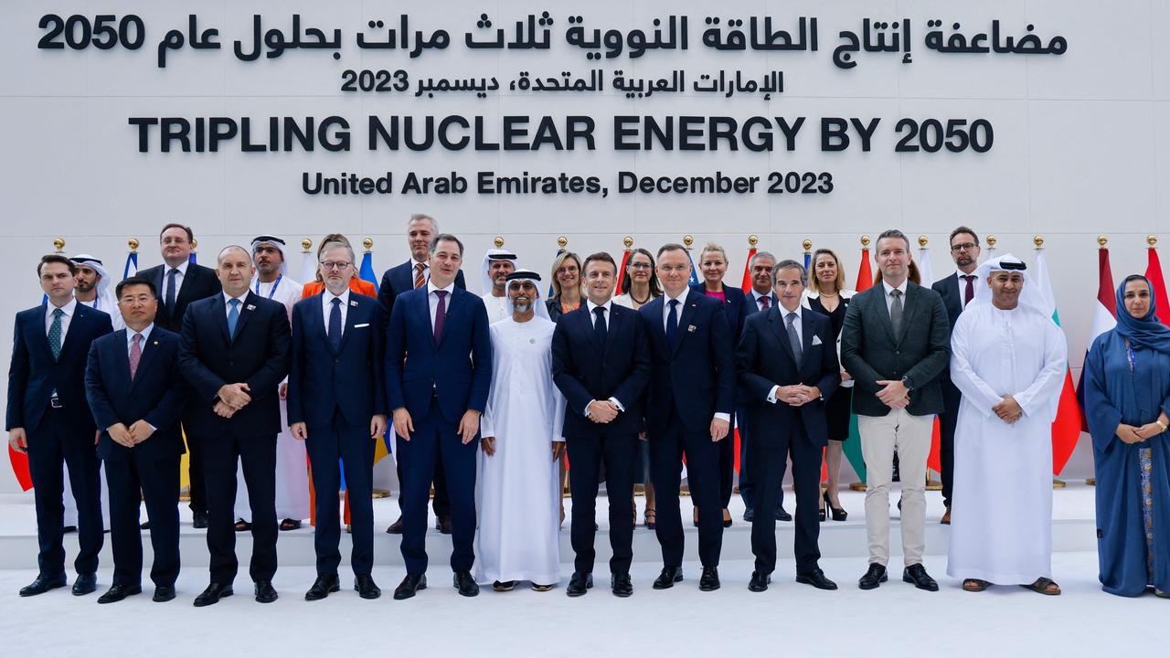 France's President Emmanuel Macron (centre) poses for a photo with other leaders and participants at COP28. Picture: Ludovic Marin / AFP