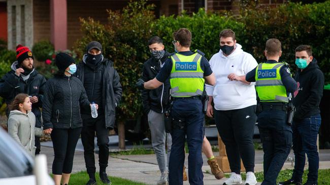 A heavy police presence as groups of people walk around the streets of Dandenong. Picture: Mark Stewart