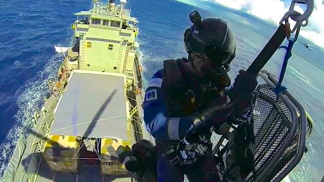 Paul Reeves on the end of a Navy winch in the South Pacific in 2013.