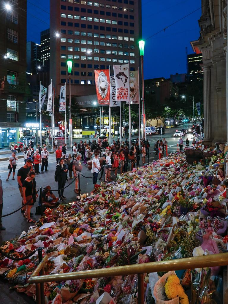 A carpet of floral tributes outside the H&amp;M on Bourke St. Picture: Wayne Taylor/Getty Images