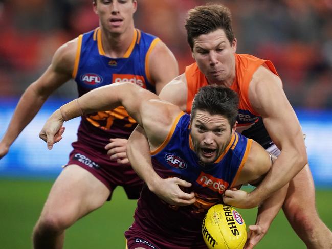 SYDNEY, AUSTRALIA - JULY 07: Stefan Martin of the Lions is tackled by Toby Greene of the Giants during the round 16 AFL match between the Greater Western Sydney Giants and the Brisbane Lions at GIANTS Stadium on July 07, 2019 in Sydney, Australia. (Photo by Matt King/Getty Images)