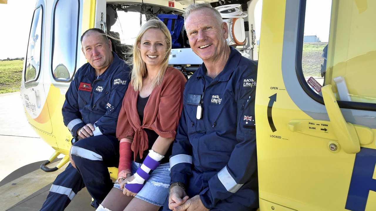 REUNION: Catching up at the Toowoomba LifeFlight base yesterday are (from left) Anthony Connolly, Tiffany Thompson - who was helped by LifeFlight last month - and Dave Hampshire. Picture: Bev Lacey