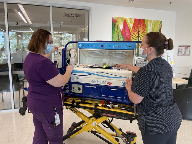 Mackay Base Hospitalâ&#128;&#153;s clinical nurse consultant Louise Johnson and Mater Privateâ&#128;&#153;s senior clinical midwife Claire Dean present the new neonatal transfer cot to help care for premature and sick infants. Photo: Zoe Devenport