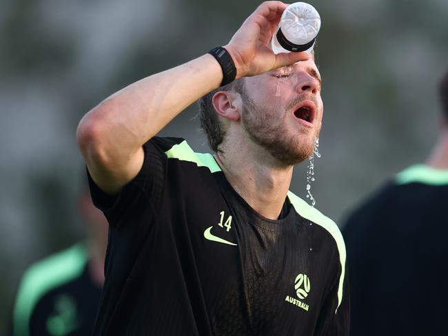 ABU DHABI, UNITED ARAB EMIRATES - MAY 21:  Riley McGree takes a water break during the Australia Socceroos player training camp at the Ritz Carlton Training Pitch on May 21, 2025 in Abu Dhabi, United Arab Emirates. (Photo by Francois Nel/Getty Images)