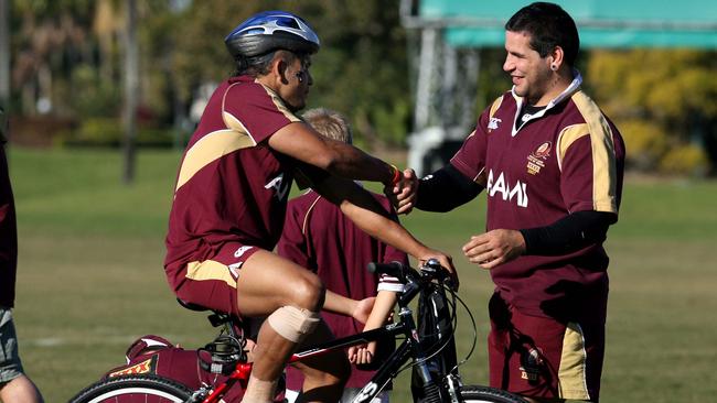 1/7/07 Qld State of Origin training camp at Sanctuary Cove. Matt Bowen is congratulated by Carl Webb when arriving at training after being brought into the team. PicAdamHead