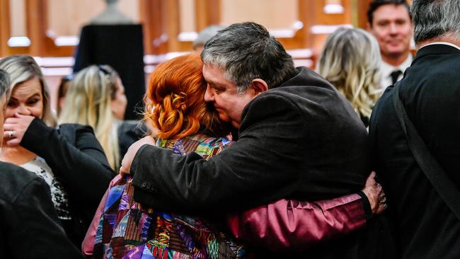 Quentin's mother Kerry Kenihan receives a hug at the memorial service. Picture: AAP / Morgan Sette