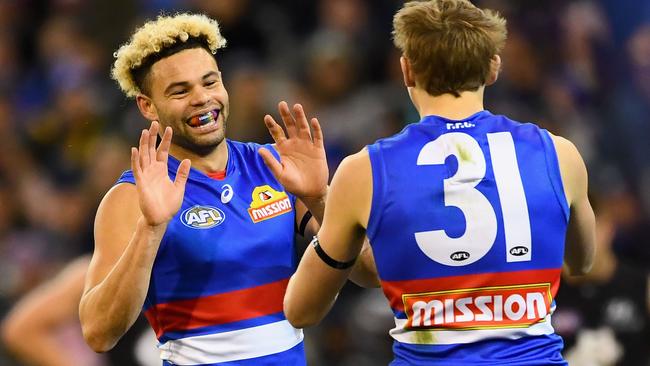 Jason Johannisen and Bailey Dale celebrate a goal.