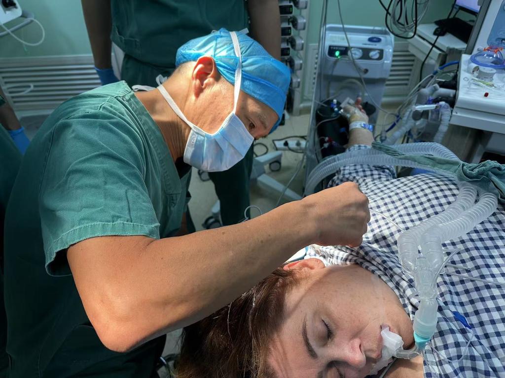 Australian patient and mother of six Tanya Miles had surgery performed by Dr Charlie Teo (left) in China. He operated on the most deadly of brain tumours - the kind of surgery that for him into strife in Australia. Picture: Supplied.