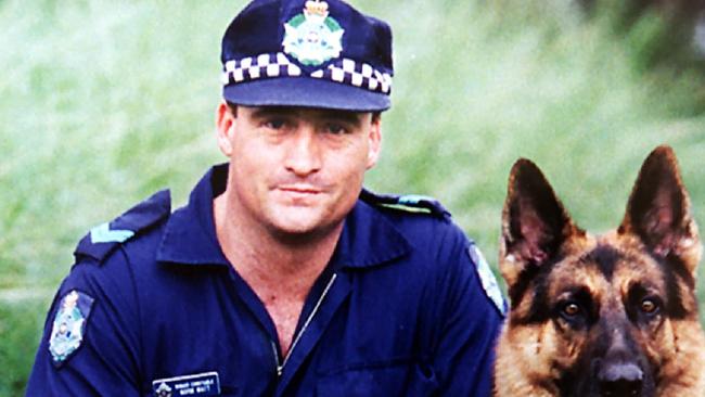 Senior Constable Norman (Norm) James Watt, 33, with his dog Zeus. Picture: Queensland Police Service