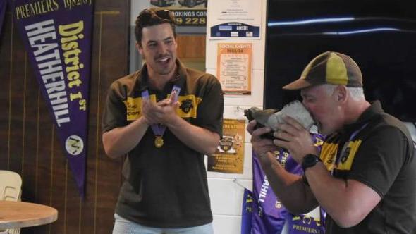 Neil Barfuss drinks from the boot while Kristian Miller looks on. Picture: Supplied