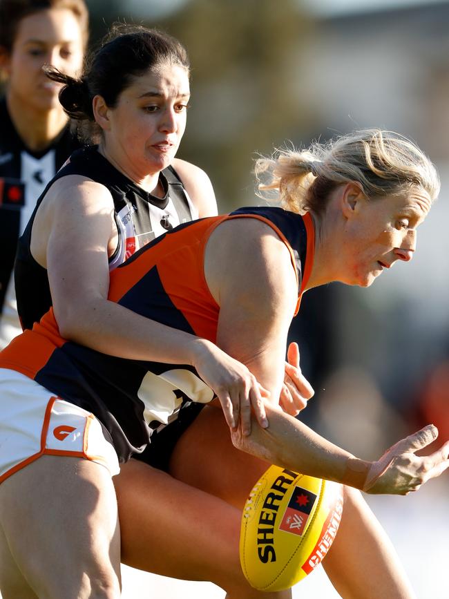 Sarah Sansonetti in action as a Collingwood AFLW player, tackling GWS forward Cora Staunton. Picture: Dylan Burns/AFL Photos via Getty Images