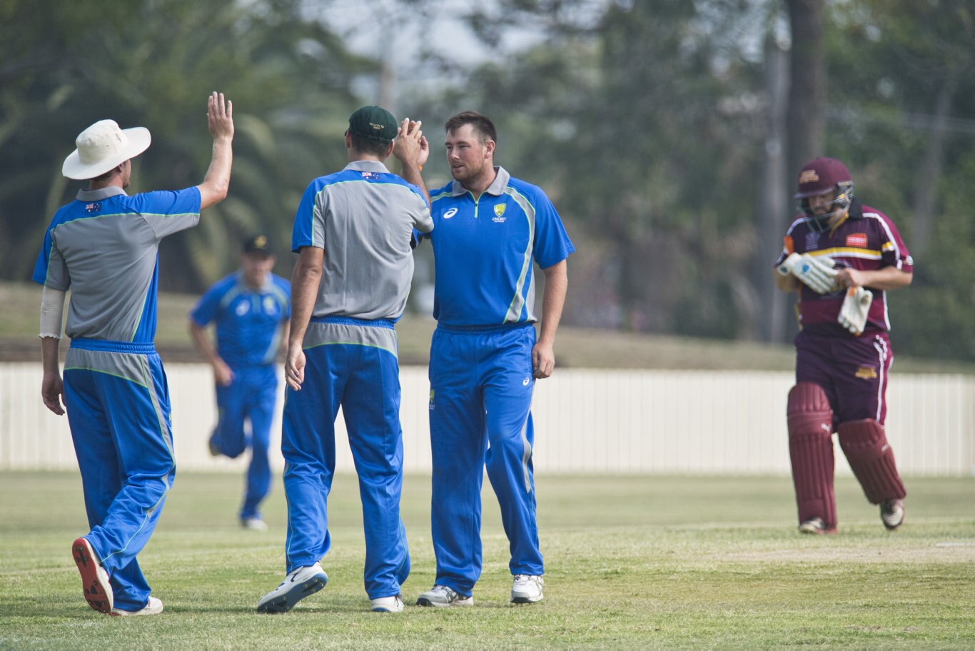 Australian Country XI players including bowler Scott Burkinshaw (right) celebrate the dismissal of Troy Gurski of Bulls Masters in Australian Country Cricket Championships exhibition match at Heritage Oval, Sunday, January 5, 2020. Picture: Kevin Farmer