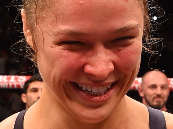 RIO DE JANEIRO, BRAZIL - AUGUST 01: Ronda Rousey of the United States celebrates her knock out victory over Bethe Correia of Brazil in the first round in their UFC women's bantamweight championship bout during the UFC 190 event inside HSBC Arena on August 1, 2015 in Rio de Janeiro, Brazil. (Photo by Josh Hedges/Zuffa LLC/Zuffa LLC via Getty Images)