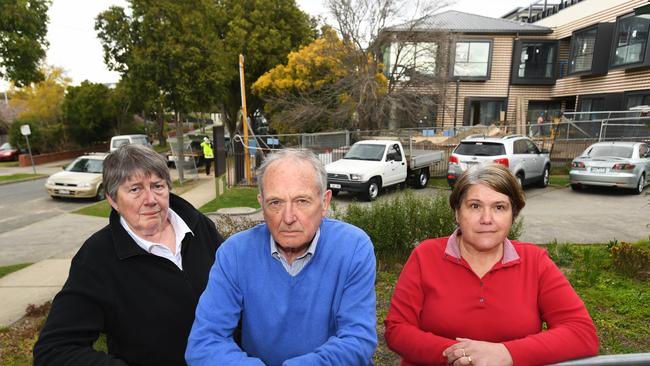 Heather Eadon, Trevor Eddy and Sue Dunn work at the neighbourhood house. Photo: James Ross