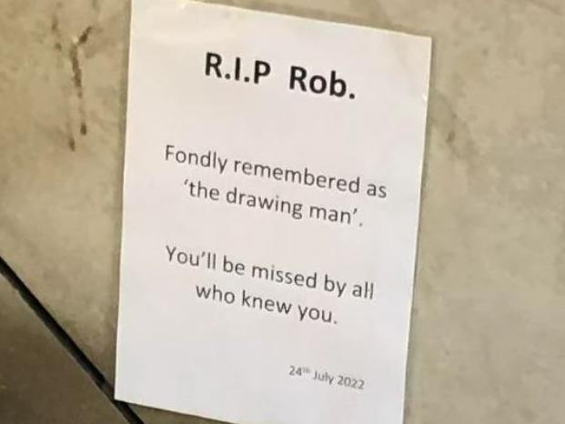 An A4 printout was taped to a wall on Glenferrie Rd commemorating Rob 'the drawing man' who was beloved for his whimsical art. Picture: @mhrauburn / Reddit